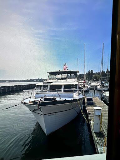 Weathered boat on a dock set for dismantling and recycling by boat salvage experts